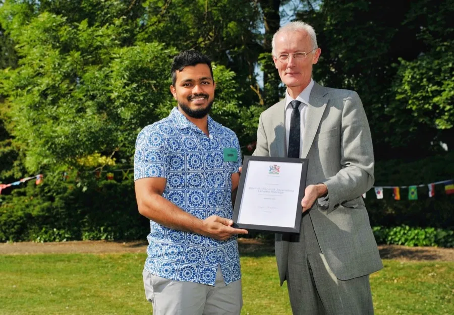Randula Jayarathna receiving a community impact award in Cheltenham, Gloucestershire